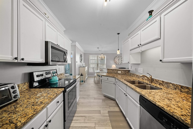 100 Ella Kinley Cir Unit 301, Myrtle Beach, SC 29588 - kitchen with stainless steel appliances, ornamental molding, a sink, white cabinets, and stone countertops