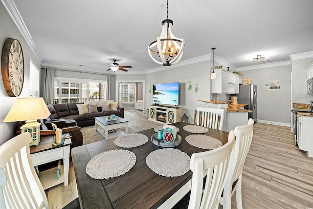 100 Ella Kinley Cir Unit 301, Myrtle Beach, SC 29588 - dining space with ceiling fan, a chandelier, light wood finished floors, and ornamental molding