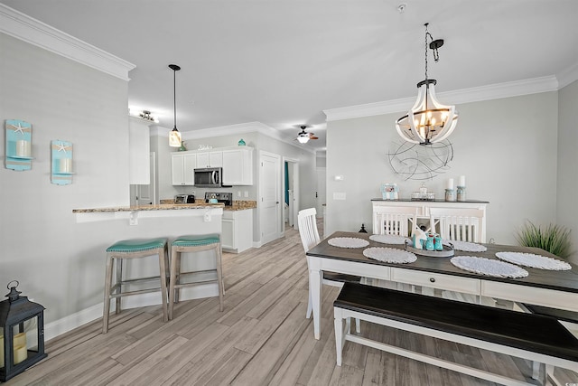 dining area featuring ornamental molding, light hardwood / wood-style floors, and ceiling fan with notable chandelier