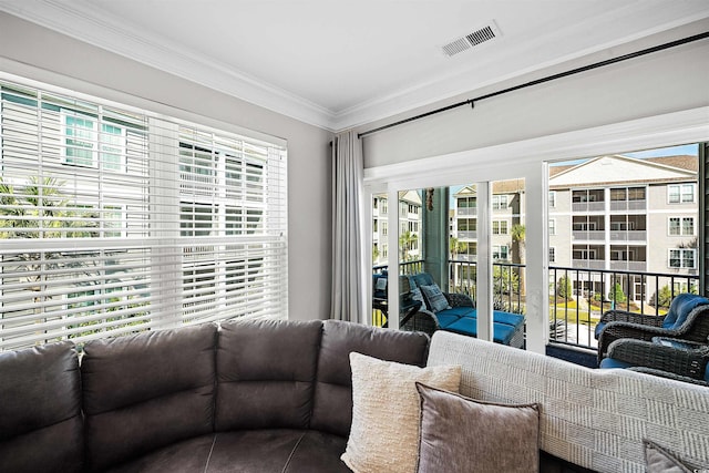 living room featuring crown molding