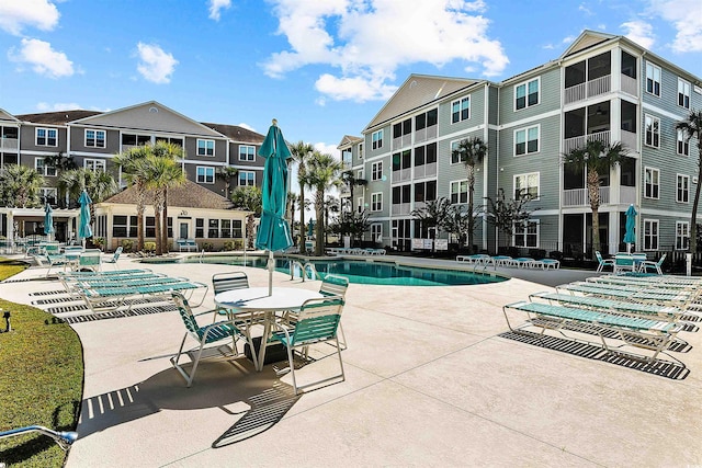 view of swimming pool with a patio area