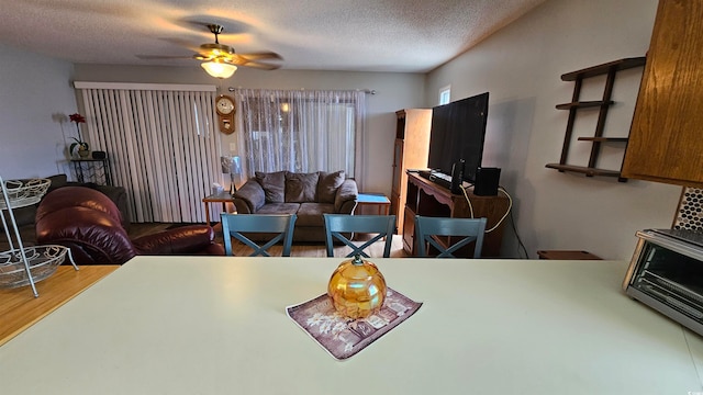 interior space featuring a textured ceiling, hardwood / wood-style floors, and ceiling fan