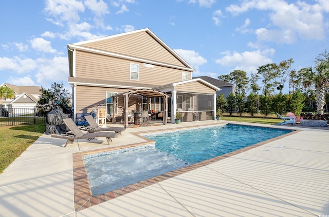 view of pool with a patio area and a sunroom