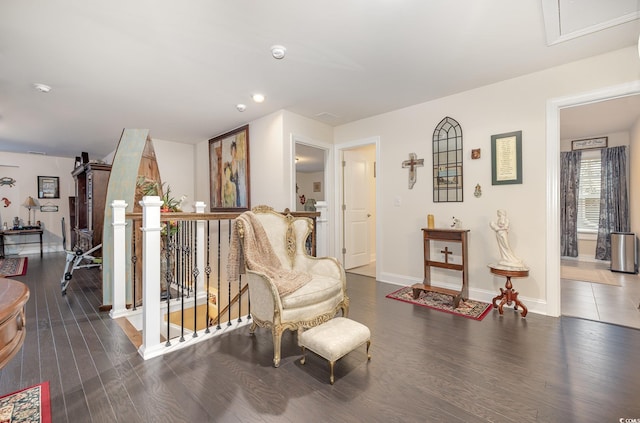 sitting room with dark hardwood / wood-style floors