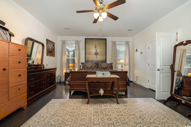 bedroom with ceiling fan, ornamental molding, and dark hardwood / wood-style flooring