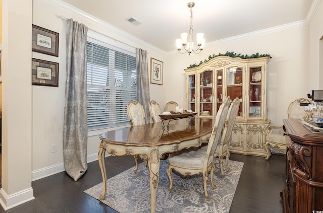 dining space featuring crown molding, a notable chandelier, and dark hardwood / wood-style flooring