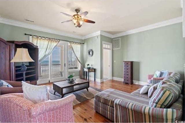 132 N Waccamaw Dr, Murrells Inlet, SC 29576 - living room featuring ceiling fan, wood finished floors, baseboards, and crown molding