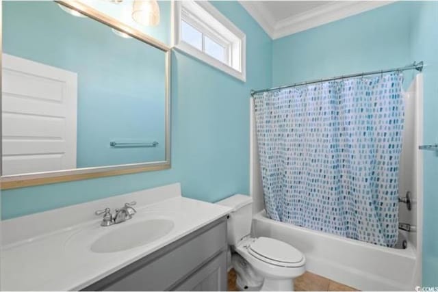 full bathroom with toilet, tile patterned flooring, shower / bath combo with shower curtain, crown molding, and vanity