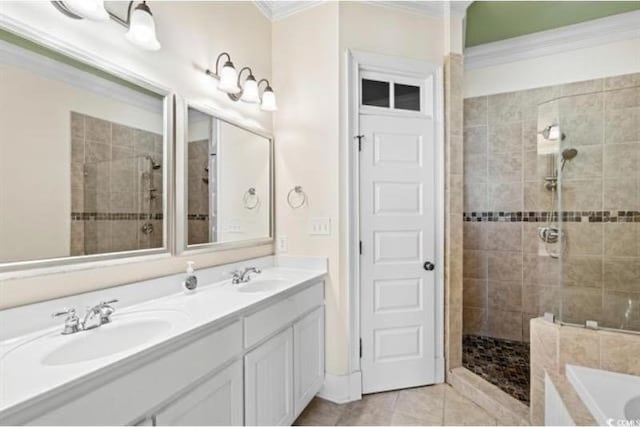 bathroom featuring vanity, crown molding, tile patterned floors, and shower with separate bathtub