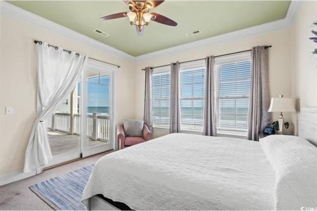 carpeted bedroom with ceiling fan, crown molding, and access to exterior