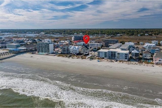 aerial view featuring a water view and a beach view