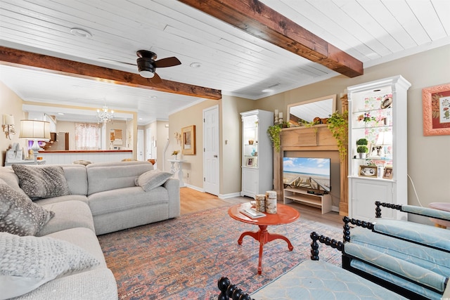 living room featuring wooden ceiling, light hardwood / wood-style floors, crown molding, beam ceiling, and ceiling fan with notable chandelier