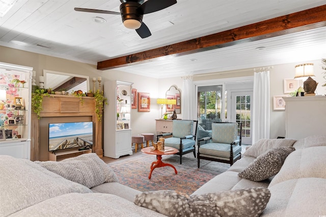 living room featuring wooden ceiling, ceiling fan, and beam ceiling