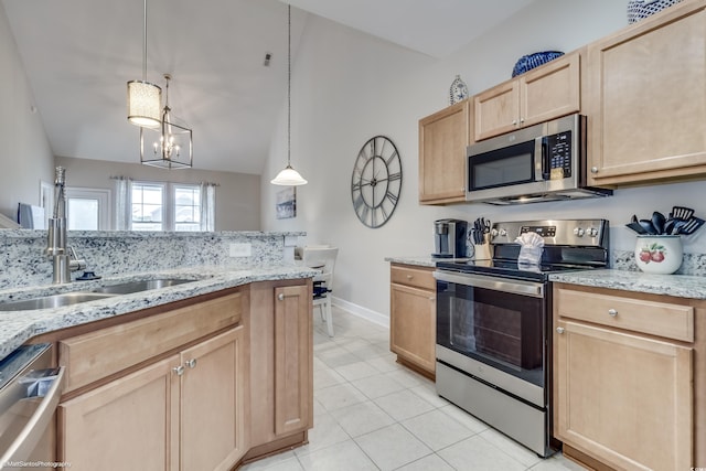 kitchen featuring light brown cabinets, hanging light fixtures, sink, an inviting chandelier, and appliances with stainless steel finishes