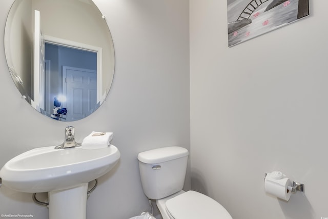 bathroom with toilet and sink