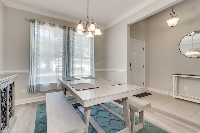 dining space featuring a notable chandelier, wood-type flooring, and crown molding