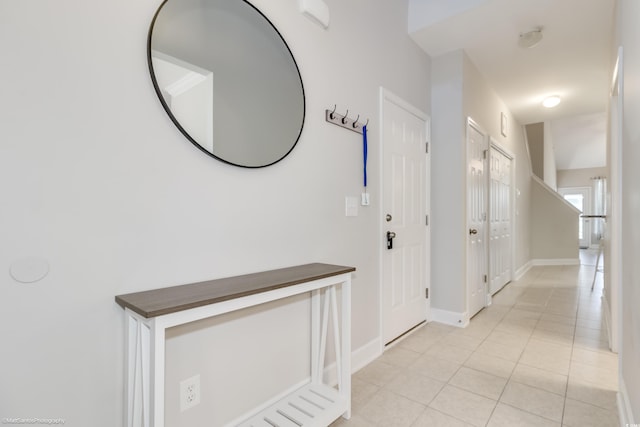 hallway with light tile patterned flooring