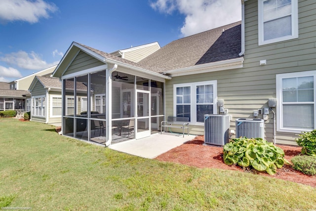 rear view of property with a yard, central AC unit, a sunroom, and ceiling fan