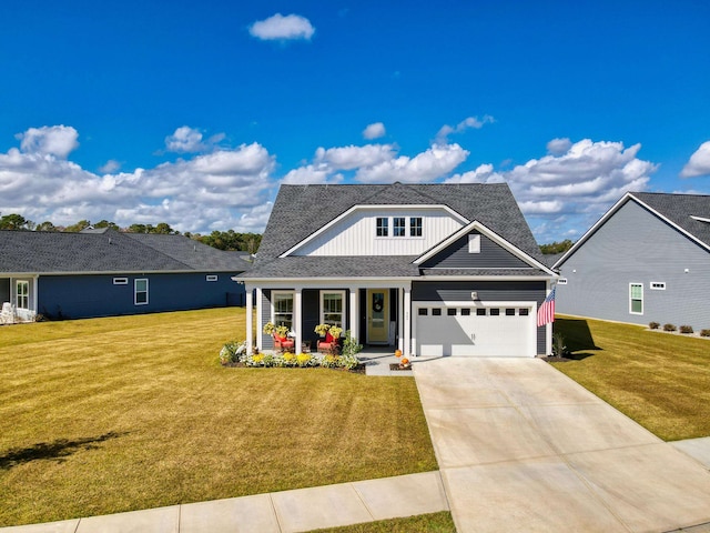 view of front of home with a garage and a front lawn