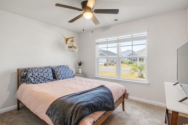 carpeted bedroom featuring ceiling fan