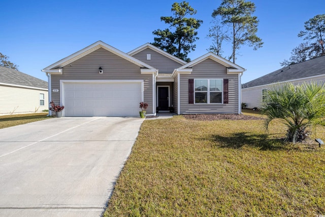 view of front of home with a front lawn and a garage