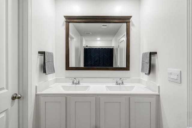 bathroom featuring vanity and a shower with shower curtain