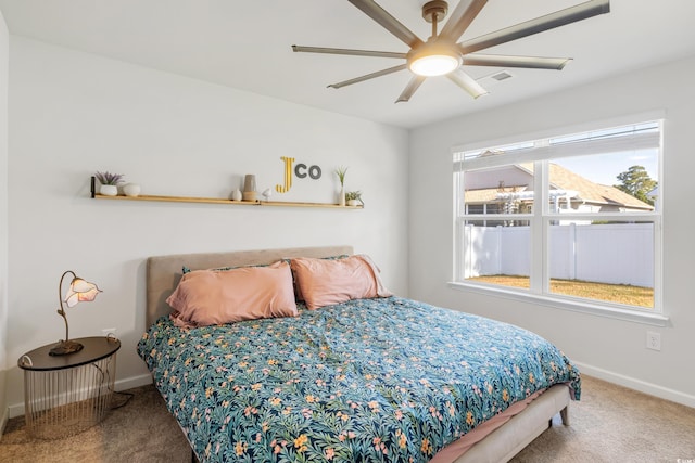 carpeted bedroom featuring ceiling fan