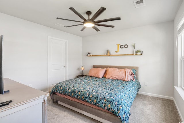 bedroom featuring light colored carpet and ceiling fan