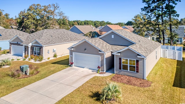 view of front of house with a garage and a front yard