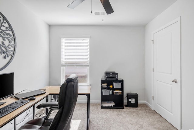 carpeted office featuring ceiling fan