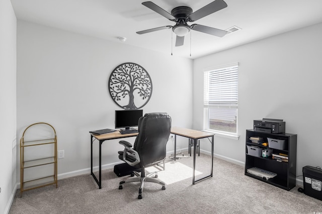 office space with ceiling fan and carpet