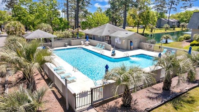 view of swimming pool with a gazebo, a water view, and a patio