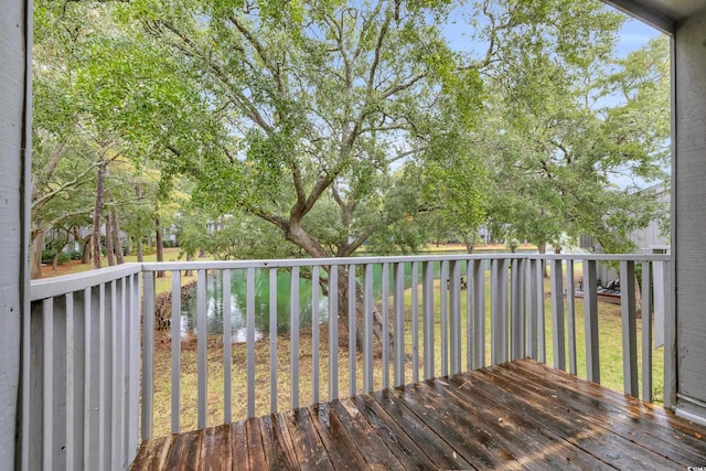 wooden deck with a water view