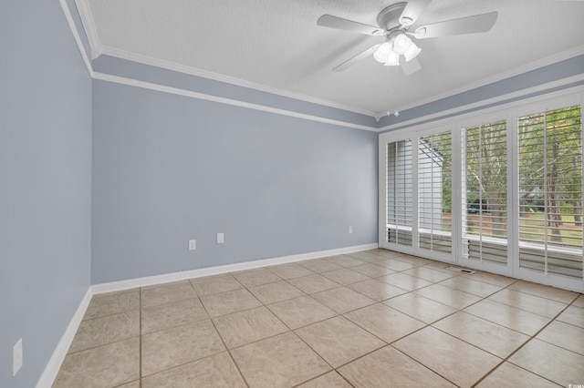 empty room with ceiling fan, light tile patterned flooring, ornamental molding, and a textured ceiling