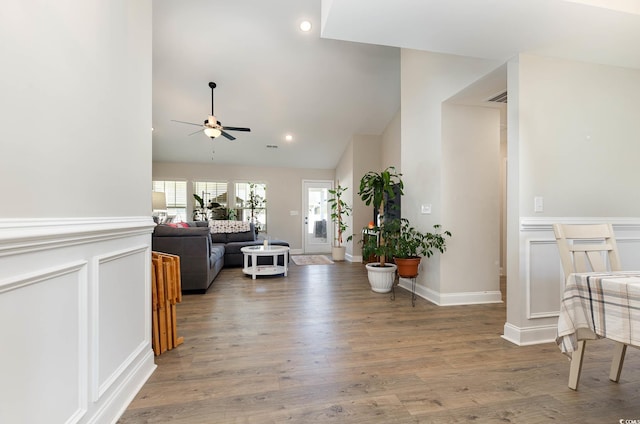 interior space featuring lofted ceiling and hardwood / wood-style flooring