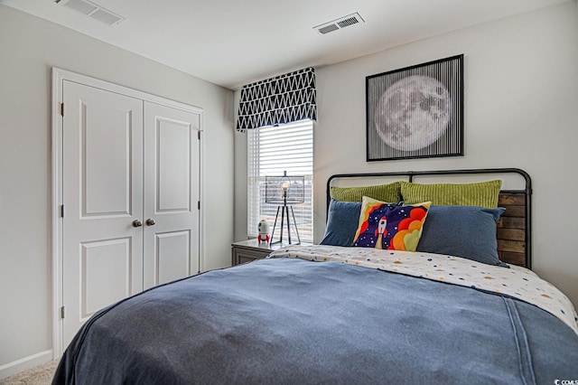 bedroom with carpet floors and a closet