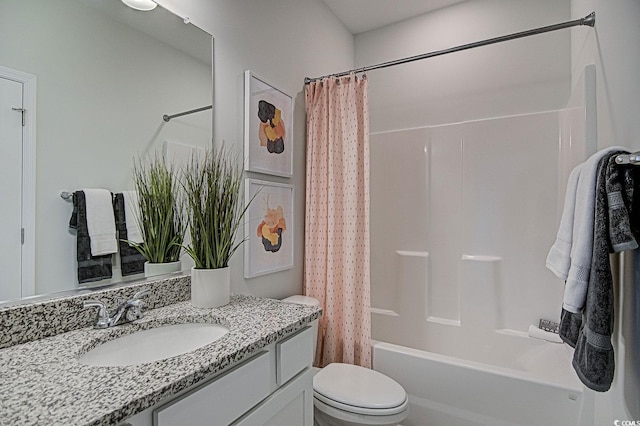 full bathroom featuring vanity, toilet, and shower / bath combination with curtain