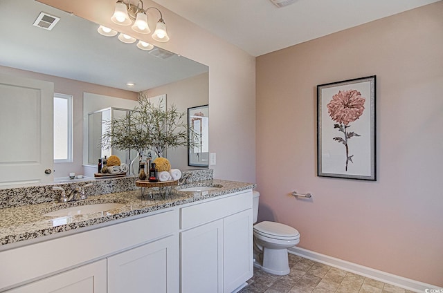 bathroom with vanity, toilet, and walk in shower