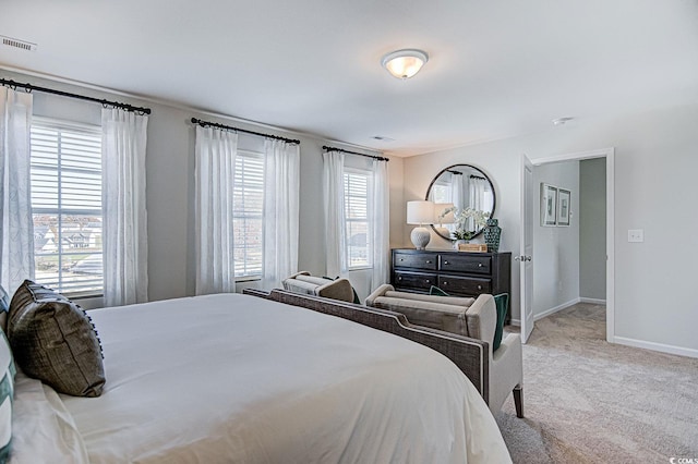 bedroom featuring light colored carpet