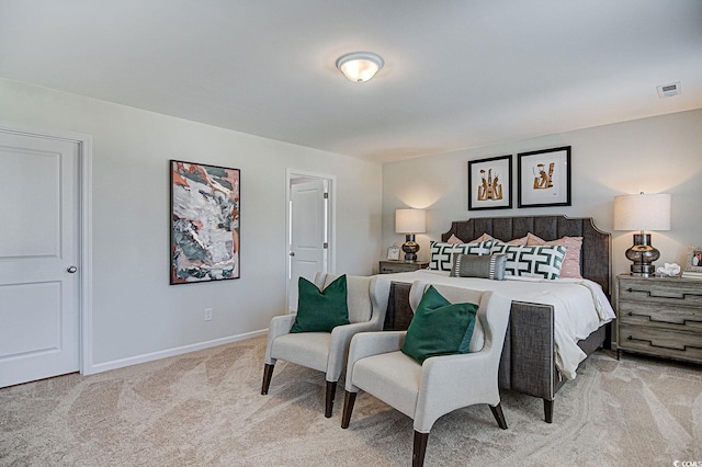 bedroom featuring light colored carpet