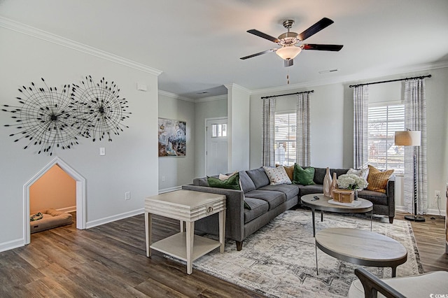 living room featuring ceiling fan, hardwood / wood-style flooring, and crown molding