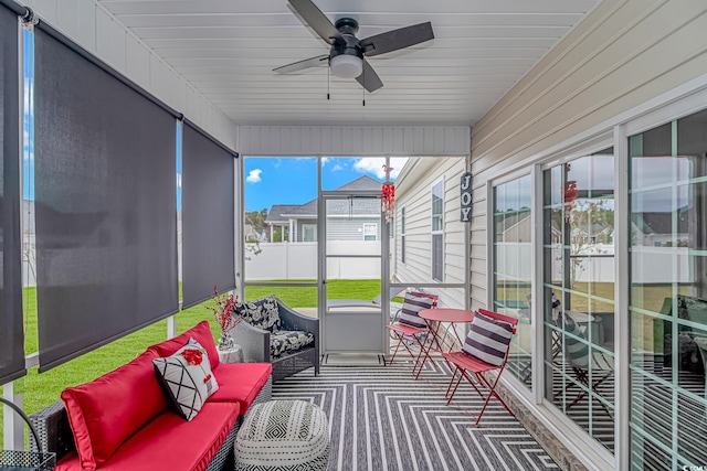 sunroom with ceiling fan and plenty of natural light