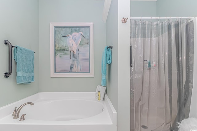 bathroom featuring separate shower and tub and crown molding