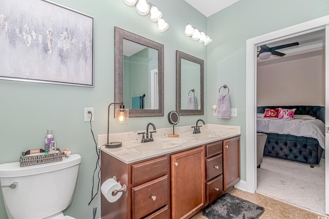 bathroom with toilet and vanity