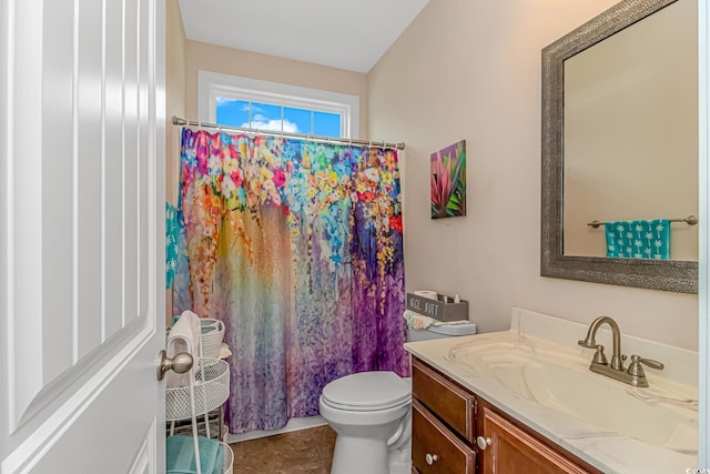 bathroom featuring walk in shower, tile patterned flooring, vanity, and toilet