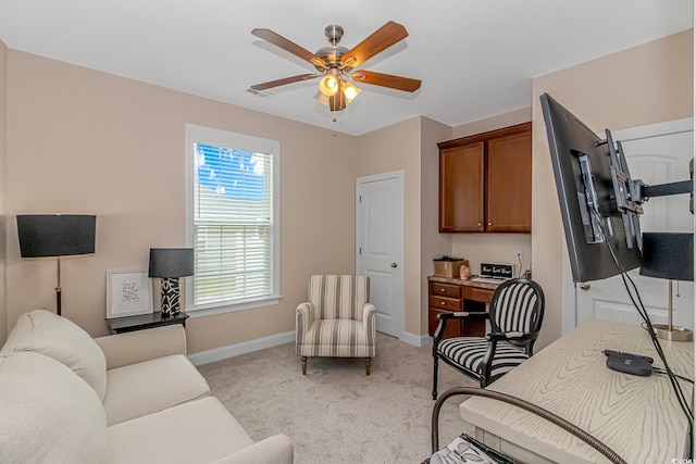 living room featuring light colored carpet and ceiling fan