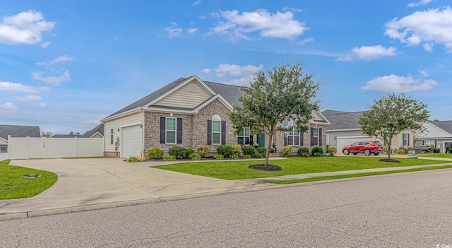 view of front of house with a front lawn and a garage