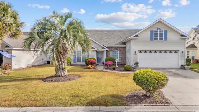 view of front facade with a front lawn and a garage