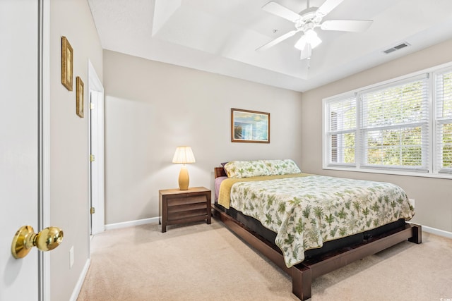 bedroom featuring light carpet and ceiling fan