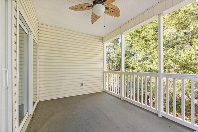 unfurnished sunroom featuring plenty of natural light and ceiling fan